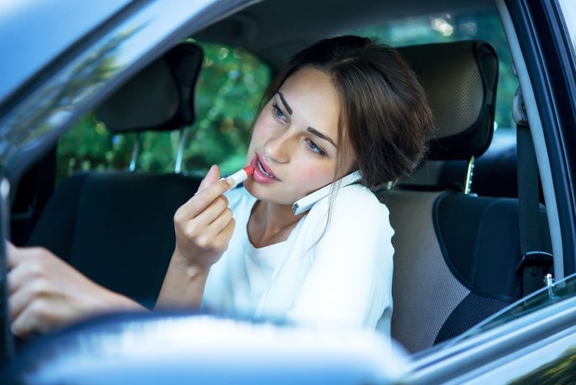 Woman Putting Make Up While Driving