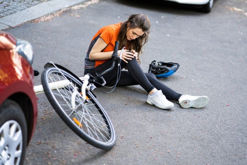 Woman Holding Her Knee After An Accident