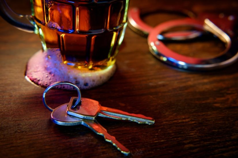 Pair Of Keys With A Beer On A Table