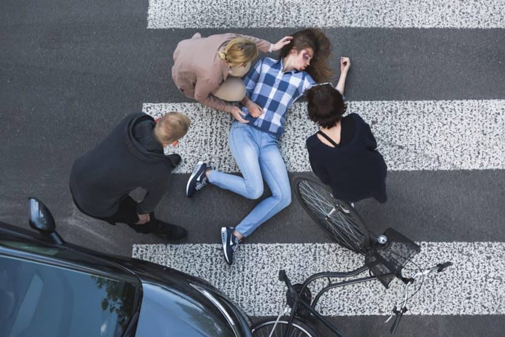 Person Laying On The Road After An Accident