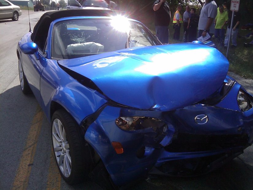 Crashed blue car