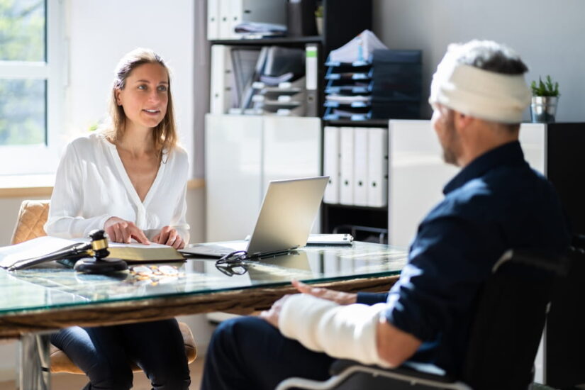 Injured Person With Bandages Talking To A Representative