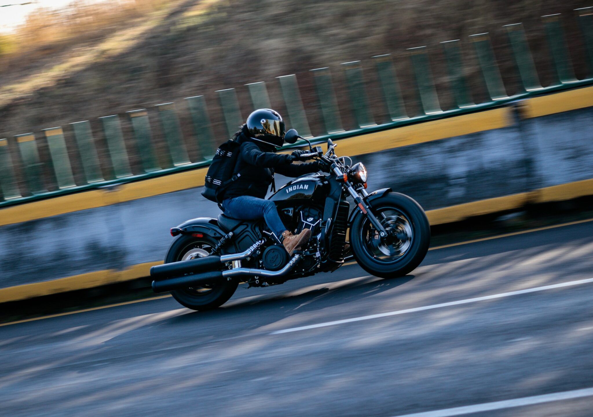 A Person Riding Really Fast On A Motorcycle