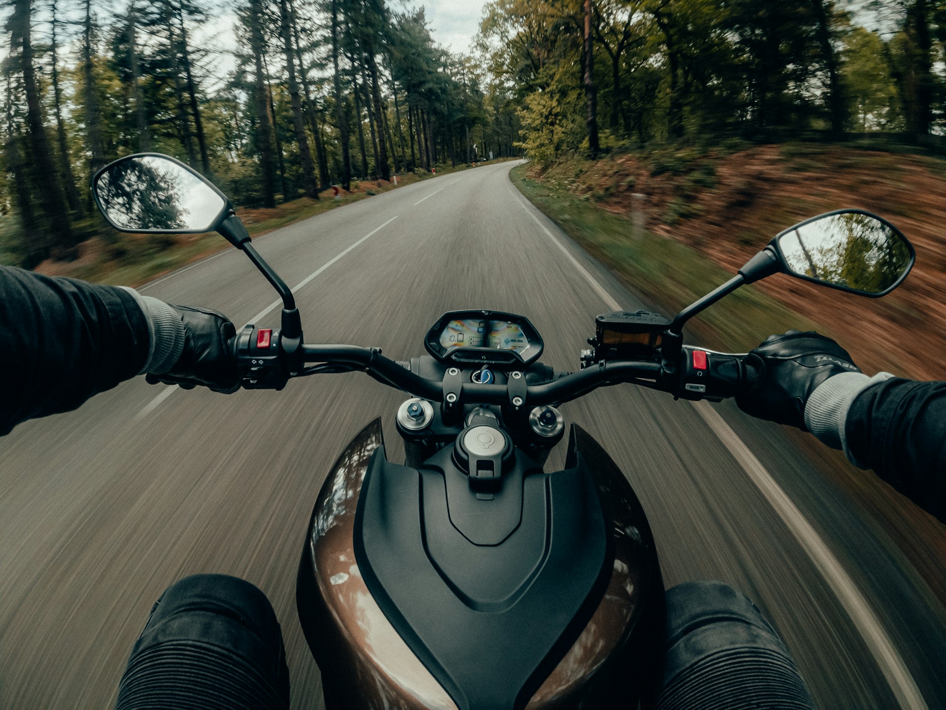 First Person View Of Someone On A Motorcycle In The Woods